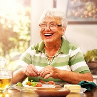 Senior woman laughing with dentures