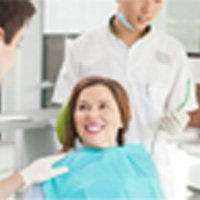 woman smiling after getting dentures 