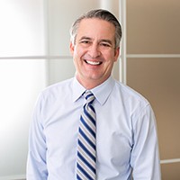 Man in shirt and tie in office