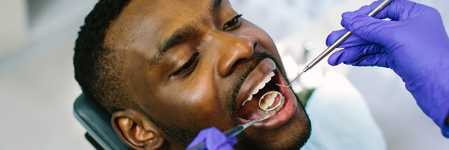 Man getting a routine checkup from his Delta Dental dentist in Bellingham