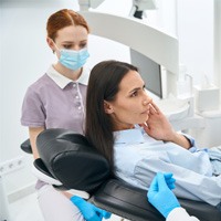 Woman at the dentist with tooth pain