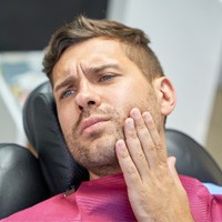 Man at the dentist with a toothache